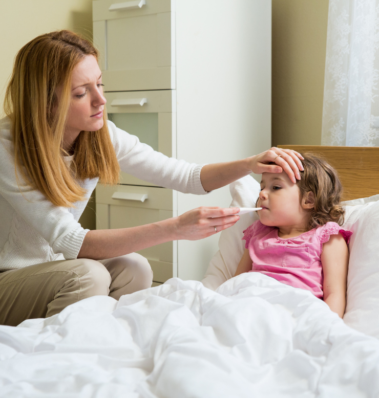 Photo is of a concerned woman taking a child's temperature. 